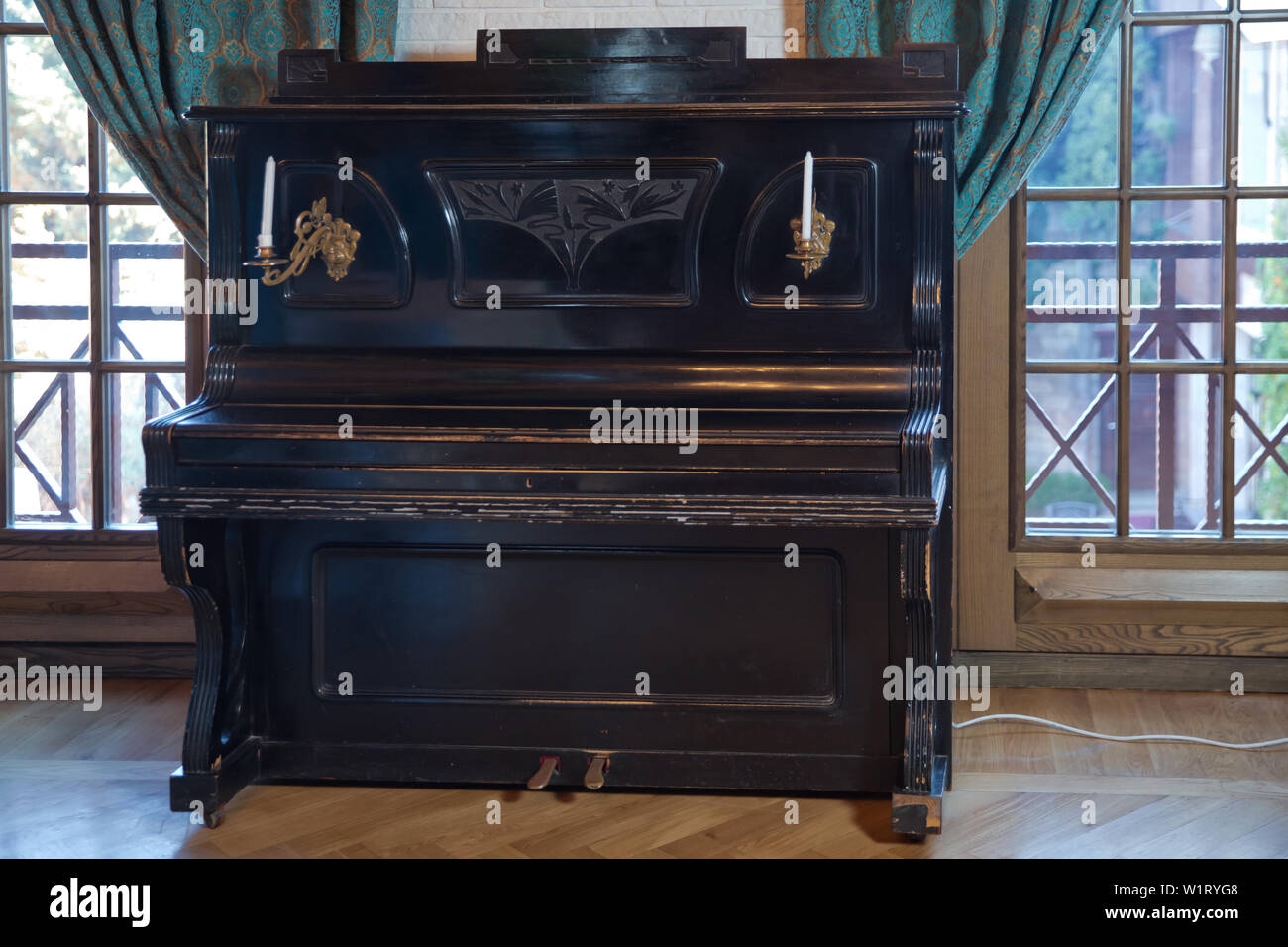 Old Wooden Black Piano Keys On Wooden Musical Instrument In Front View Old Wooden Black Piano Black Piano Stands Against The Wall Stock Photo Alamy