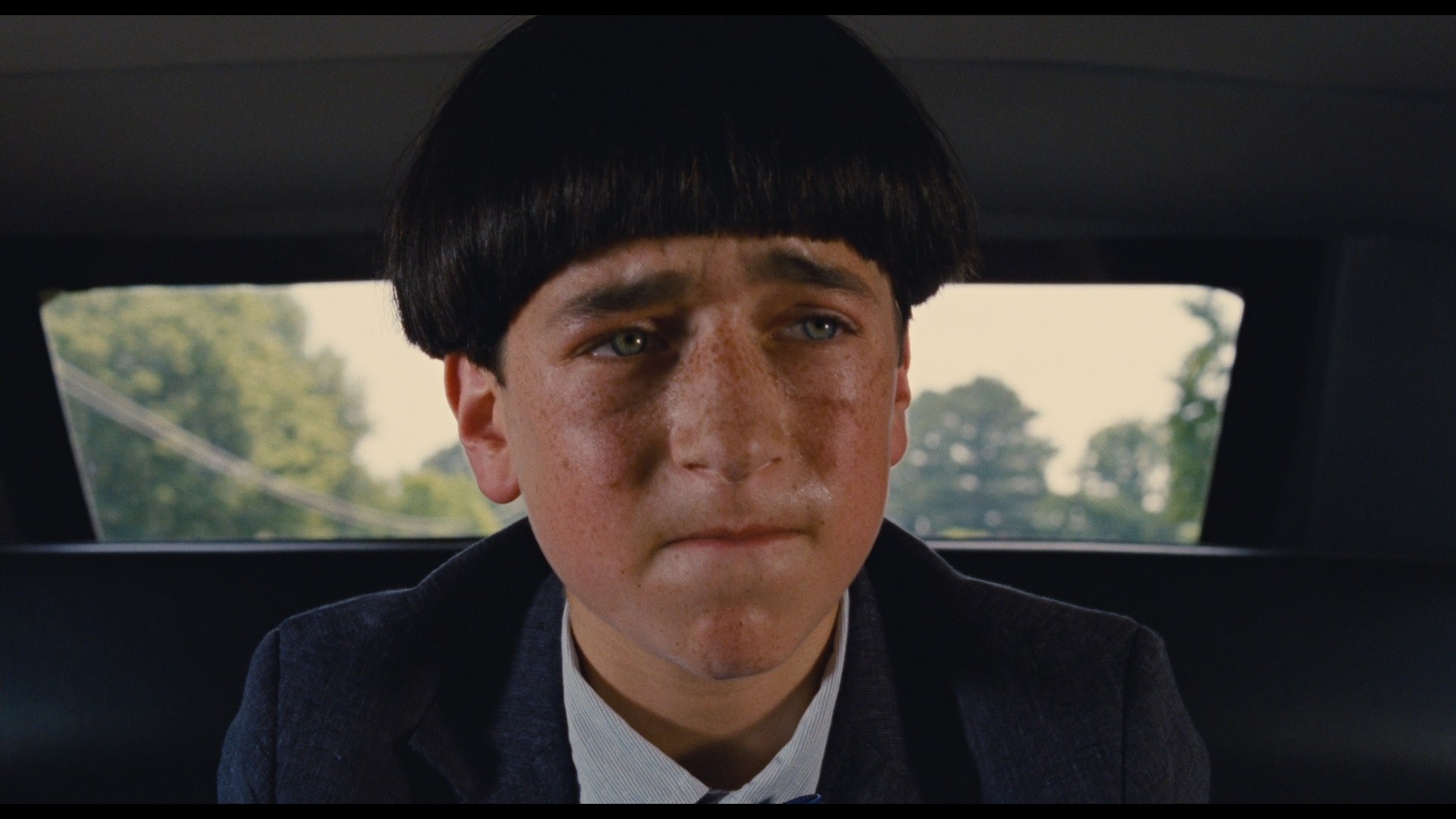 stooge with a bowl cut